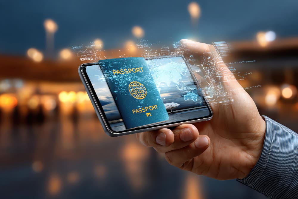 A hand holds a smartphone displaying a digital passport at night

